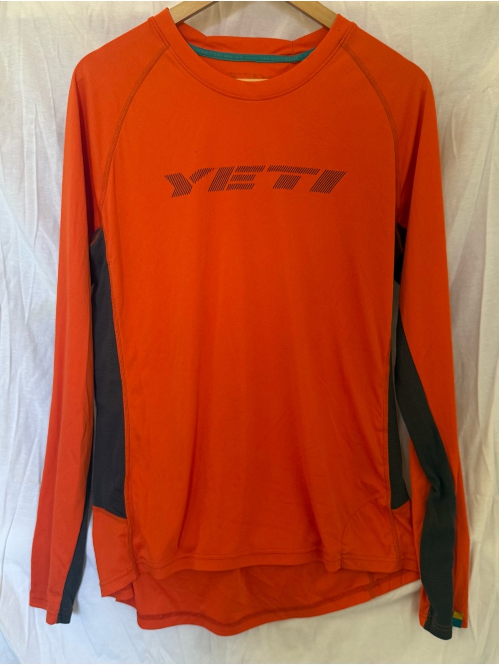 Yeti Orange Performance Tee with Teal Accents